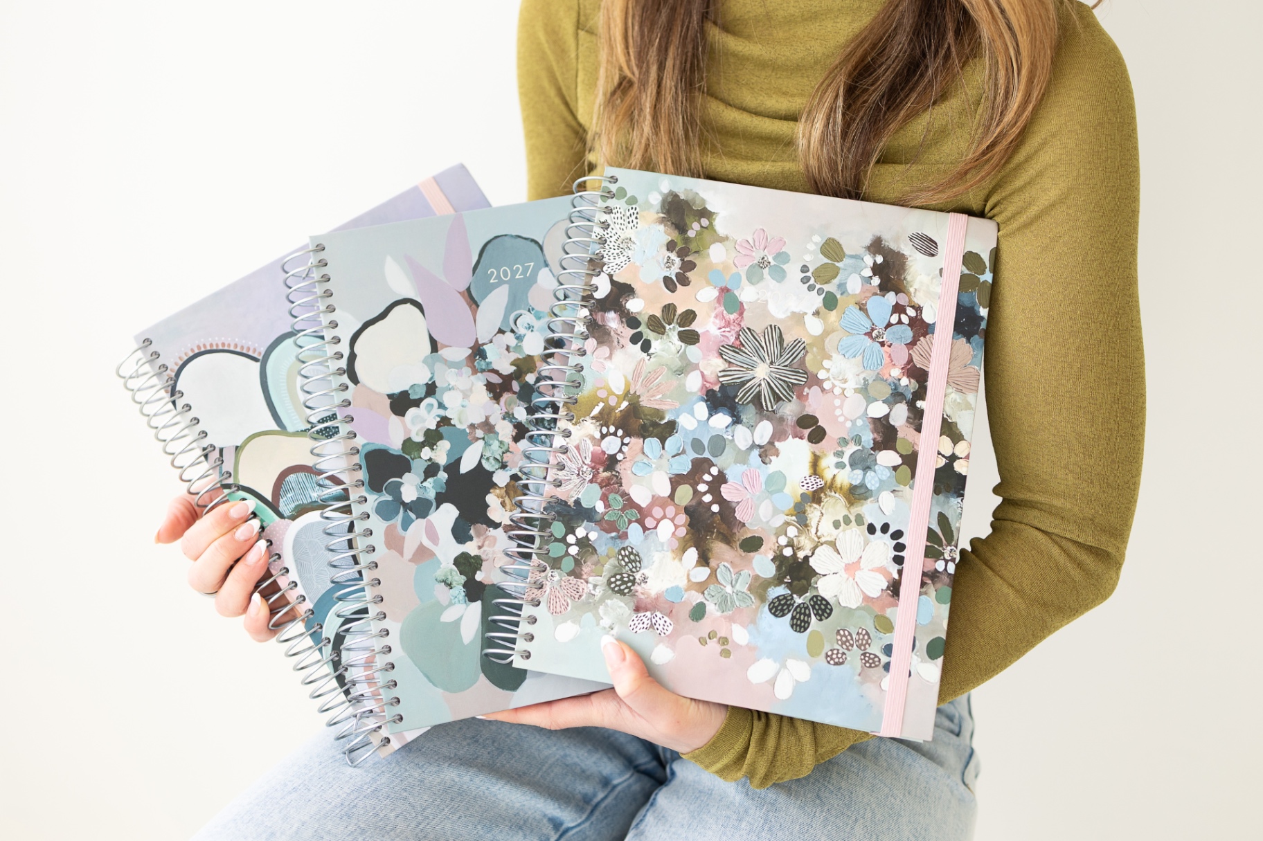 The Artist Series planners held in hand
